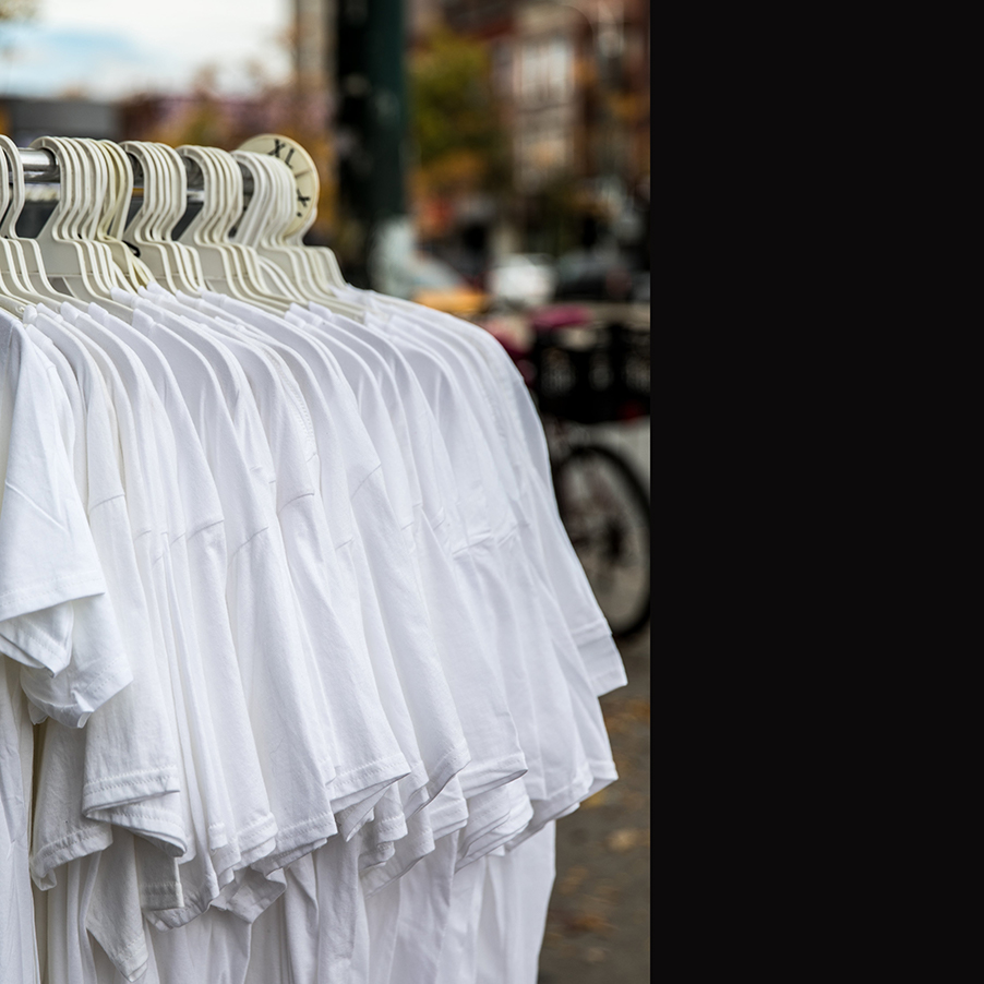 simple-white-shirts-on-shop-clothing-rack